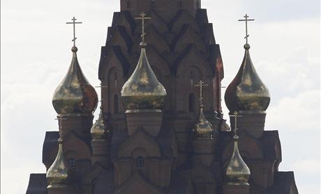 A tourist tent stands in front of an Russian Orthodox church in Lesosibirsk town