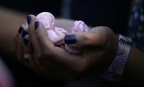 A prolife activist holds clay dolls in the shape of fetuses during a protest in Mexico City September 28, 2011. Mexico's Supreme court upheld a law within the Baja California state constitution that says that life begins at conception, signaling a victory for anti-abortion campaigners. Seven out of eleven ministers deemed the measure unconstitutional but eight votes were needed to overturn it.