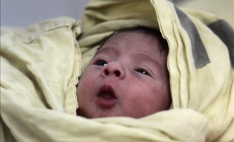 A baby is seen inside the childbirth unit at hospital Escuela in Tegucigalpa