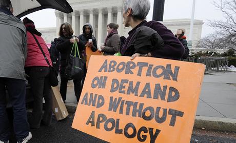 Abortion rights protestors arrive to prepare for a counter protest against March for Life anti-abortion demonstrators on the 39th anniversary of the Roe vs Wade decision, in front of the U.S. Supreme Court building in Washington
