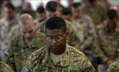 Members of US Military praying
