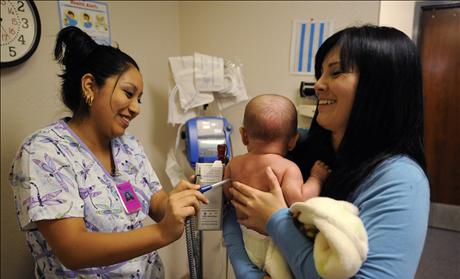 Nursing assistant with baby