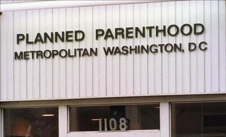 A GUARD TURNS AWAY THE PRESS AT PLANNED PARENTHOOD IN D.C.