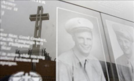 Mount Soledad Cross is seen in reflection on war memorial