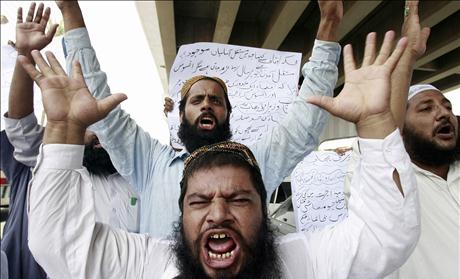 Supporters of Pakistani Islamist party celebrate President Pervez Musharraf's resignation in Multan