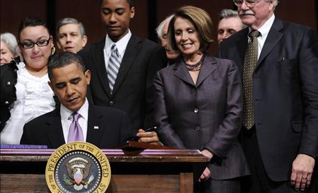 House Speaker Pelosi and Rep. Miller look on as U.S. President Obama signs the Health Care and Education Reconciliation Act into law at Northern Virginia Community College in Alexandria