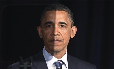 President Barack Obama pauses as seen through a teleprompter as he delivers a speech on U.S. fiscal and budgetary deficit policy at the George Washington University