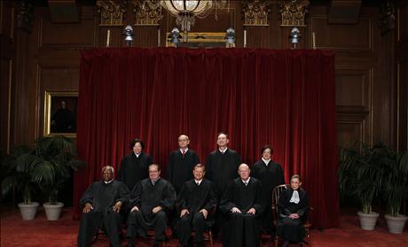 Justices of the U.S. Supreme Court pose for formal group photo in the East Conference Room in Washington
