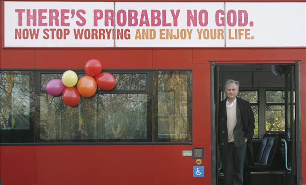 British author Richard Dawkins stands on a bus at the launch of an atheist advertising campaign in London