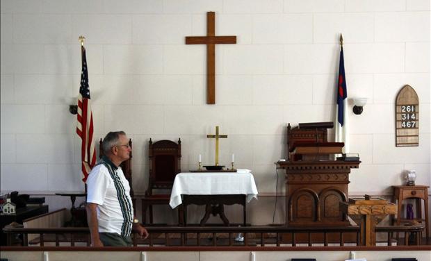 Howard Grace walks through the West Unity Community United Methodist Church before joining the weekly Bible study group in Unity 