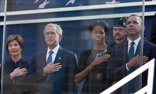 U.S. President Barack Obama, first lady Michelle Obama, former president George W. Bush (2nd L) and Laura Bush salute the flag during tenth anniversary ceremonies at the National September 11 Memorial at the World Trade Center site in New York, September 11, 2011. The 9/11 attacks changed life in the United States forever, but 10 years after the devastating hit, New Yorkers have learned to live in a more dangerous world and are ready to move on. 
