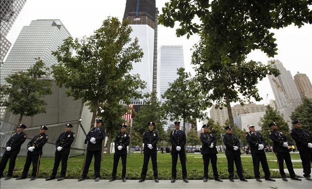 NYPD officers, FDNY firefighters and Port Authority Police line up at one of the entrances of 9/11 Memorial Plaza during ceremonies marking the 10th anniversary of the 9/11 attacks on the World Trade Center, in New York, September 11, 2011.