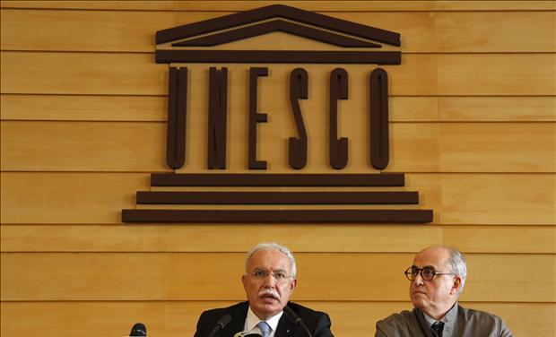 Palestinian Foreign Minister al-Malki and Palestinian ambassador to UNESCO Sanbar attend a press conference during the 36th session of UNESCO's General Conference in Paris - United Nations