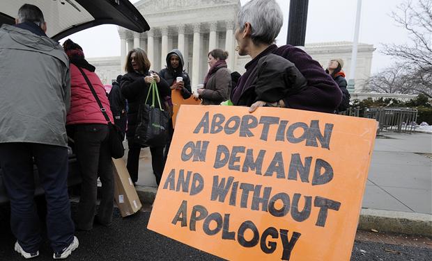 Abortion rights protestors arrive to prepare for a counter protest against March for Life anti-abortion demonstrators on the 39th anniversary of the Roe vs Wade decision, in front of the U.S. Supreme Court building in Washington 