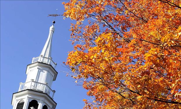 The steeple of The First Congregational Church is juxtaposed with fall colors in Sharon, Connecticut.