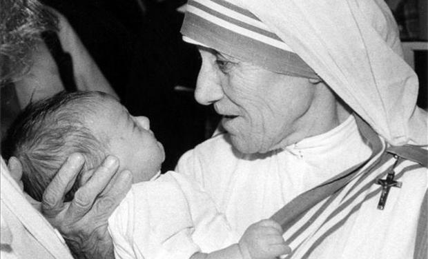 Mother Teresa holding baby