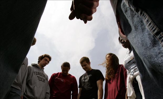 Virginia Tech students and others pray for the victims shot in the Virginia Tech tragedy during a group multi-denominational prayer meeting on the campus in Blacksburg