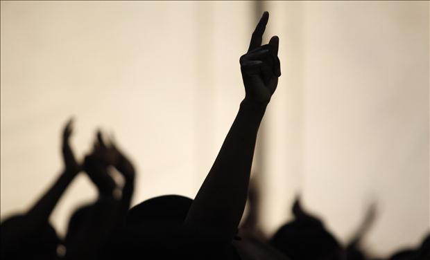 Members of the Redeemed Christian Church of God are silhouetted as they pray at Redemption Camp in Floyd