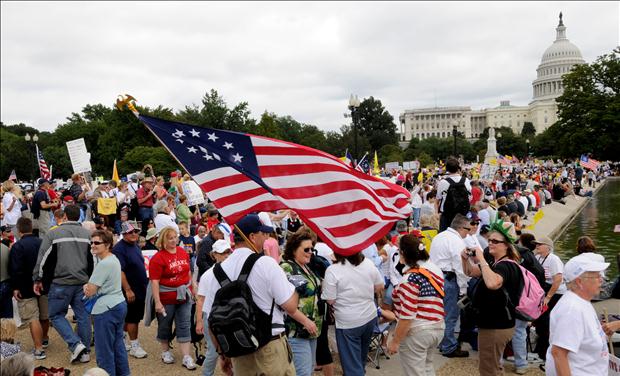 Demonstrators gather on the plaza near the U.S. Capitol to participate in a protest against Obama's fiscal and economic policies in Washington