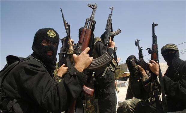 Palestinian militants from the Islamic Jihad group attend the funeral of their comrade Mohammed Moamar in Rafah, in the southern Gaza Strip
