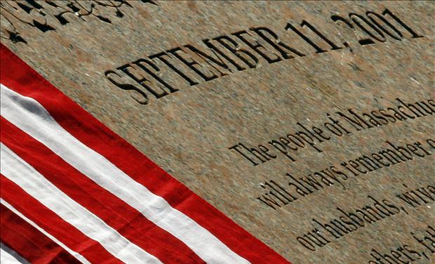 U.S. flag rests on the memorial to Massachusetts victims of the attacks of September 11, 2001 in Boston