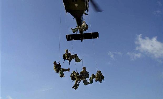 AUSTRALIAN ARMY BLACKHAWK HELICOPTER FLIES NEAR BALIBO.