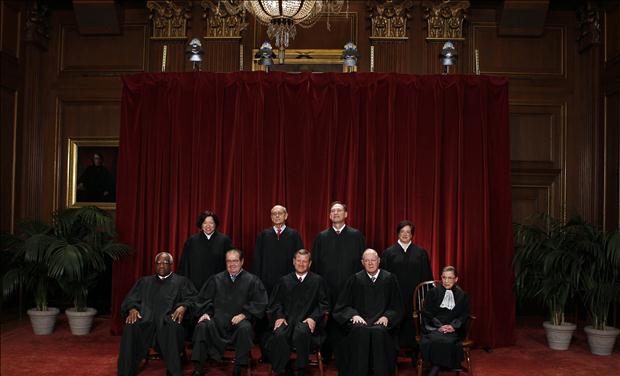 Justices of the U.S. Supreme Court pose for formal group photo in the East Conference Room in Washington