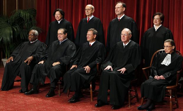 Justices of the U.S. Supreme Court pose for formal group photo in the East Conference Room in Washington
