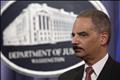U.S. Attorney General Eric Holder pauses at a news conference at the Justice Department in Washington
