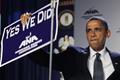 U.S. President Barack Obama holds up a sign at the American Nurses Association house of delegates meeting in Washington