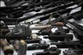 Seized weapons and guns are displayed to the media by the Mexican Navy in Mexico City