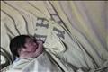 A baby is seen inside the childbirth unit at hospital Escuela in Tegucigalpa