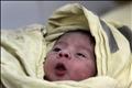A baby is seen inside the childbirth unit at hospital Escuela in Tegucigalpa
