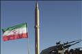An Iranian surface-to-surface missile rests on a launch platform in preparation for a test firing in the Iranian desert - Iran