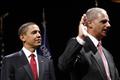 U.S. President Barack Obama looks on as Attorney General Eric Holder takes his oath during a ceremonial installation at George Washington University in Washington 