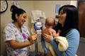 Nursing assistant with baby