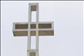 Men walk past Mount Soledad Cross which will be transferred to be owned by federal government