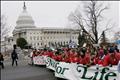 Protesters march past U.S. Capitol Building during march for life in Washington