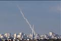 Trails of smoke are seen after launch of rockets from northern Gaza Strip