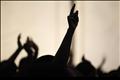 Members of the Redeemed Christian Church of God are silhouetted as they pray at Redemption Camp in Floyd