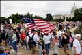 Demonstrators gather on the plaza near the U.S. Capitol to participate in a protest against Obama's fiscal and economic policies in Washington