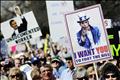 Protestors hold signs against President Obama's health care legislation in Washington