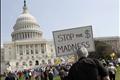 Opponents of the proposed U.S. health care bill are pictured during a rally outside the U.S. Capitol Building in Washington