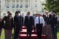 U.S. President Barack Obama arrives with Chuck Canterbury, president of the Grand Lodge of the Fraternal Order of Police, to deliver remarks at the National Peace Officers' Memorial at the U.S. Capitol