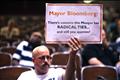 A demonstrator holds a sign during a Landmarks Commission's hearing on the proposed Cordoba Mosque to be built near the site of the former World Trade Center in New York