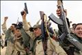 Libyan government soldiers celebrate at the west gate of town Ajdabiyah