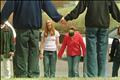 STUDENTS HOLD HANDS IN PRAYER AFTER STABBING AT HIGH SCHOOL.