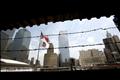 Flags fly over Ground Zero and the Freedom Tower site in New York July 19, 2006.