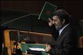 Iran's President Mahmoud Ahmadinejad holds up a copy of the Koran as he addresses the 65th United Nations General Assembly in New York