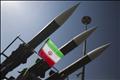 An Iranian flag is pictured next to missiles during a war exhibition to mark the anniversary of the Iran-Iraq war at Baharestan square near the Iranian Parliament in southern Tehran